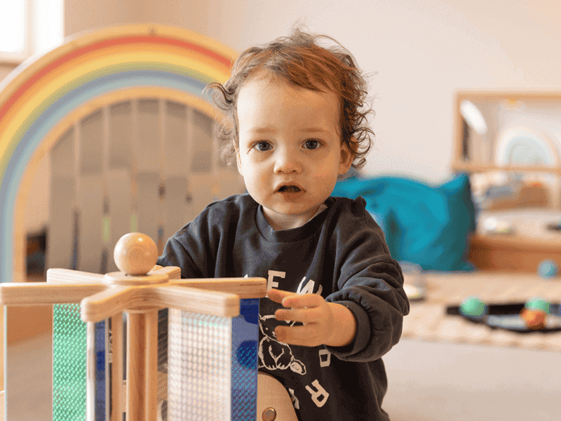 child-playing-with-wooden-toy
